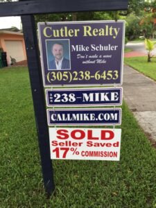 Real estate sign showing a sold home with seller savings on commission.