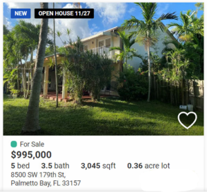 Spacious 5-bedroom home with lush tropical landscaping and large yard.